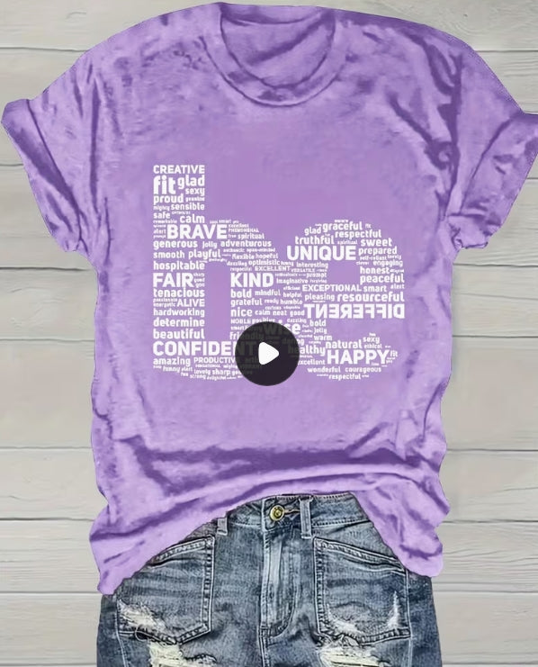"be" Tee
