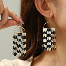 Cece Black and White Tassel Earrings